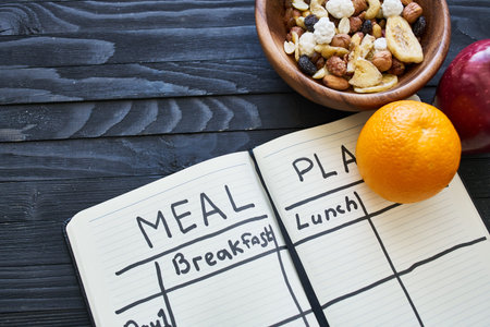 breakfast proper nutrition diet plan lifestyle wooden backgroundの写真素材