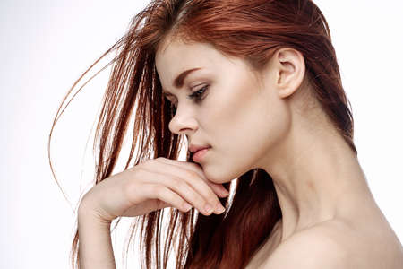 red-haired woman attractive look naked shoulders cosmetics smileの写真素材