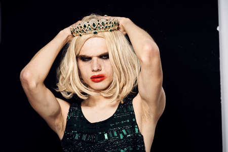 man in womens dress wig makeup posing bisexualの写真素材