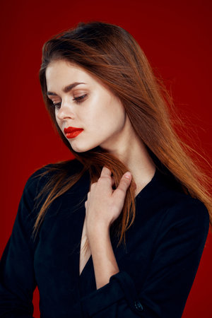 pretty woman with red lips red hair Glamor posing red background
