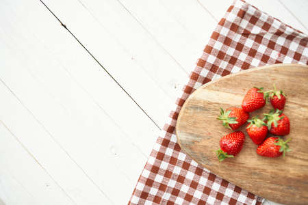 fresh strawberries on wooden board fruit vitamins summerの写真素材
