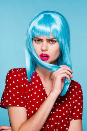 cheerful woman in a red dress according to the formula hair makeup modelの写真素材