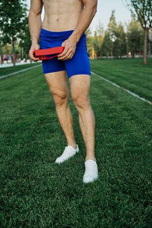 athletic man working out in the park crossfit exerciseの写真素材