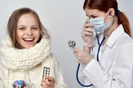 girl with white scarf medicine cure coldの写真素材