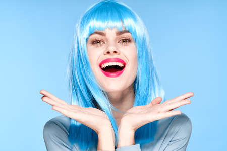 woman in port wig bright makeup red lips posingの写真素材