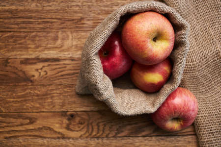apples on a wooden table vitamins fresh fruits organicの写真素材