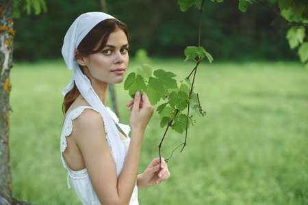 cheerful woman outdoors in the garden countryside ecology natureの写真素材