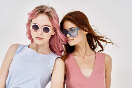 two women in fashionable clothes posing model decorationの写真素材