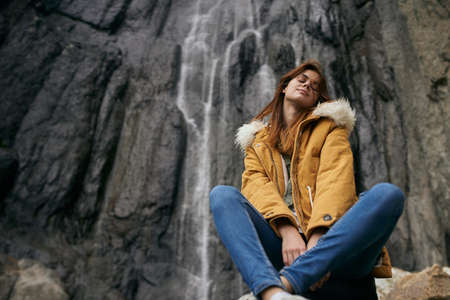 woman hiker with backpack mountains travel adventure freedomの写真素材