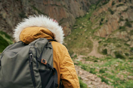 woman hiker with backpack mountains travel adventure freedomの写真素材