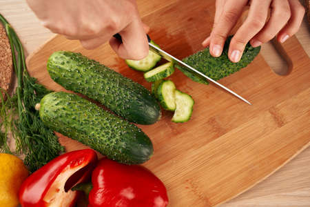 Ingredients slicing salad in the kitchen vitamins view from aboveの写真素材