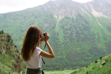 woman photographer outdoors travel lifestyle professional landscapeの写真素材