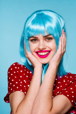 cheerful woman in a red dress according to the formula hair makeup modelの写真素材