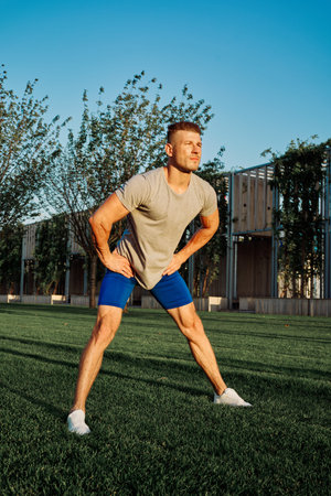 sporty man workout in park crossfit exercise summer