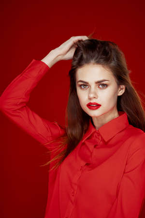 woman in red shirt posing fashion red lips funの写真素材