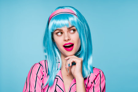 smiling woman purple hair red lips posing blue background