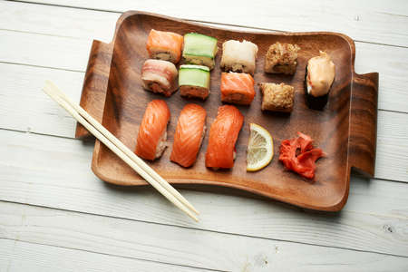 sushi wooden plate chopsticks traditional food restaurantの写真素材