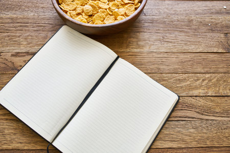 dry breakfast cereals notepad diet wooden backgroundの写真素材