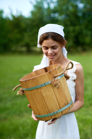 Woman in white dress countryside village nature ecologyの写真素材