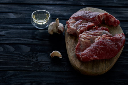 meat steak on wooden board ingredients top view foodの写真素材