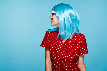 cheerful woman in blue wig sunglasses Glamor makeupの写真素材