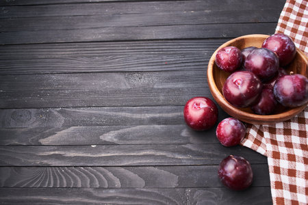 plums fruits natural products on a wooden table top view