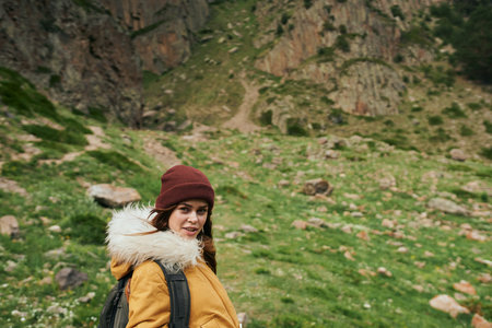 woman hiker with backpack mountains travel adventure freedom