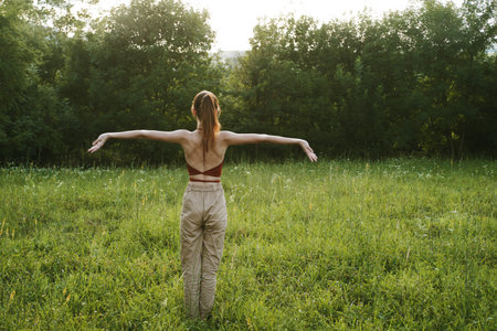 woman in a field outdoors summer meditation fresh air