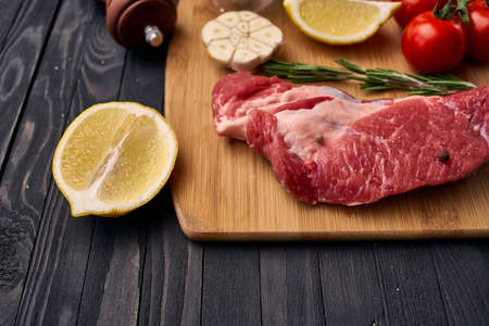 meat vegetables ingredients on a wooden board beefの写真素材