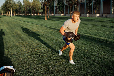 sporty man workout in the park exercise lifestyleの写真素材