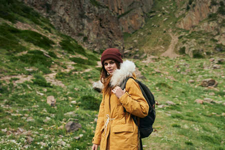 woman hiker with backpack mountains travel adventure freedomの写真素材