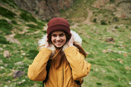 woman hiker with backpack mountains travel adventure freedomの写真素材
