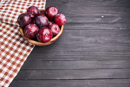 plums fruits natural products on a wooden table top viewの写真素材