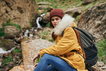 woman hiker with backpack mountains travel adventure freedomの写真素材