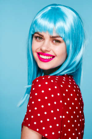 cheerful woman in a red dress according to the formula hair makeup modelの写真素材