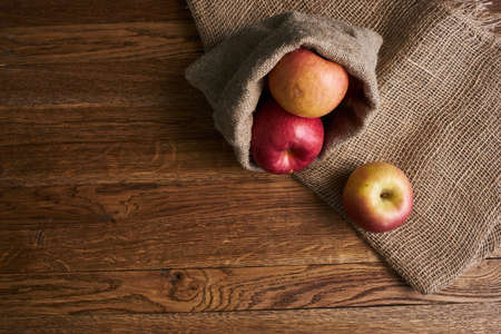 apples on a wooden table vitamins fresh fruits organicの写真素材