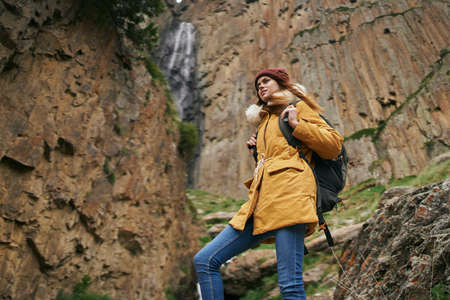 woman hiker with backpack mountains travel adventure freedomの写真素材