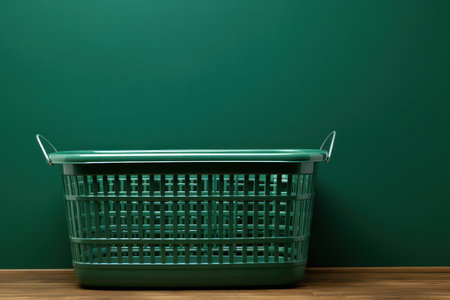 Clean, modern kitchen interior with empty white container on wooden tableの素材