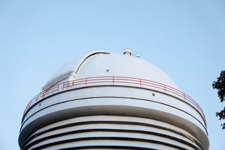 majestic white dome with vibrant red and white railing atop its impressive baseの写真素材
