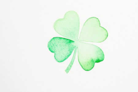 Green shamrock illustration symbolizing good luck and harmony, perfect for spring themes, with a soft watercolor design and a light, refreshing color paletteの素材