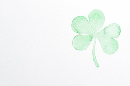 Green clover leaf illustration symbolizing luck and prosperity, featuring a light pastel color scheme on a clean white backgroundの素材