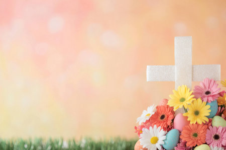 Easter cross surrounded by colorful flowers and eggs, symbolizing renewal and hope during the Spring season Floral arrangement features daisies, tulips, and vibrant colorsの素材