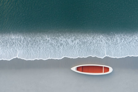 Serene Aerial View of a White Boat on a Calm Ocean Beach with Gentle Waves and Sandy Shorelineの素材