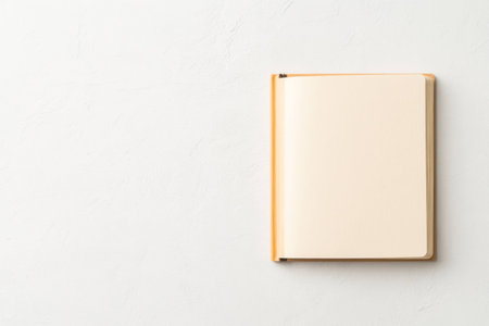 Minimalistic blank notebook on a soft background, perfect for note taking, journaling, or creative writing with a neutral color paletteの素材