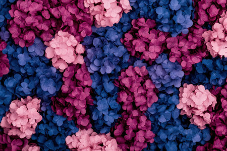 Abstract floral background featuring vibrant pink, purple, and blue flowers creating a visually stunning pattern suitable for seasonal designs and promotionsの素材