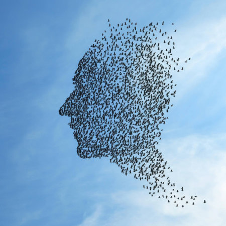 A silhouette of a human face composed of birds soaring in the sky, symbolizing freedom and the interconnectedness of nature and humanityの素材
