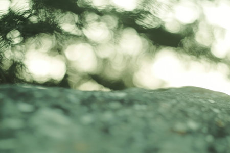 Dreamy blurred background with soft green tones evoking tranquility, perfect for nature themed designs, relaxation, and mindfulness practicesの素材