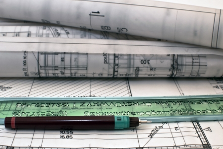 heap of design and project drawings on table backgroundの写真素材