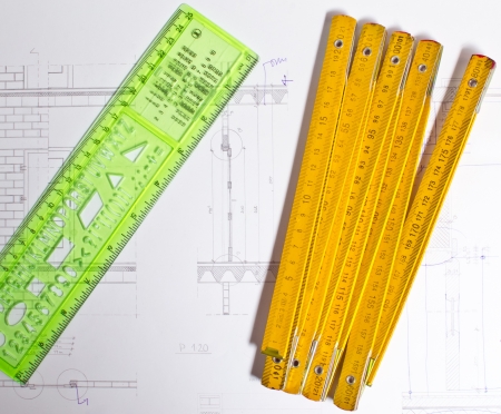 architect design and project drawings on table backgroundの写真素材