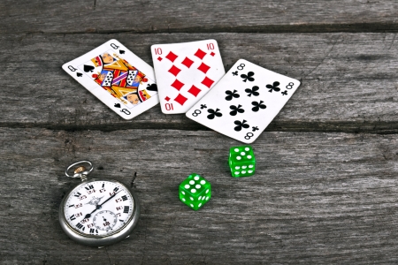 Cards and dices on vintage old woodの写真素材